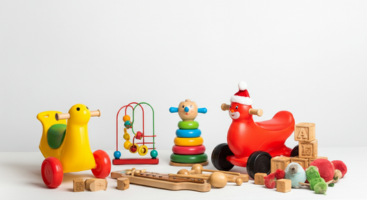 Christmas toys for 2-year-olds including ride-on toys, stacking rings, wooden blocks, bead maze, and toddler musical instruments on white background