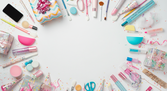 Teen birthday gift flat lay with beauty products, makeup brushes, phone, and colorful party supplies on white background